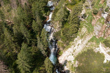 closeup aerial view of waterfalls and trail in val di fanes veneto italy
