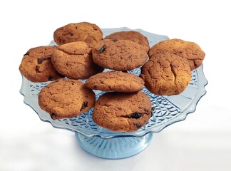 tasty brown cakes on blue glass plate