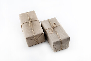 couple of gifts in kraft paper, giftbox on isolated white background