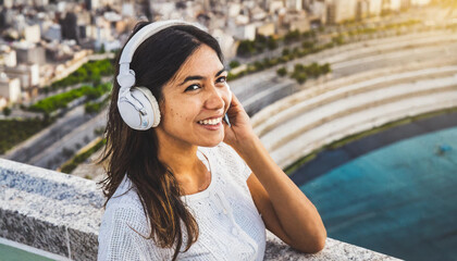 woman listening to music with headphones in the city