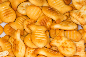 Salty crackers in form of small fishes, close-up