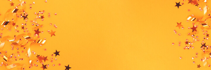 Banner with golden confetti on a yellow background. Place for text.