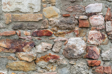 abstract stone background of stones and bricks wall of an old house