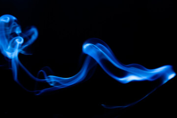 Fototapeta premium Illustration of blue beautiful smoke on the black background