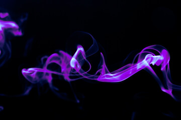 Illustration of purple beautiful smoke on the black background 