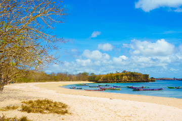 scene of a pristine beach near Pink Beach in Lombok, Indonesia.