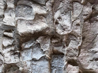 Fototapeta premium Stone wall texture. Gray realistic background for design banners, postcards, flyers, posters. Empty form for text. Vintage aged shabby rough stone texture. Vector illustration.