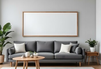 A modern living room with a gray sofa, white walls, and a large empty wooden frame on the wall.