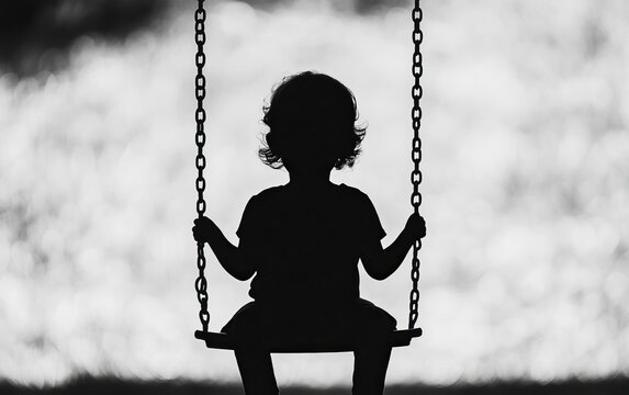 Silhouette of a child sitting on a swing, capturing a moment of innocence and joy against a soft, blurred background. - Powered by Adobe
