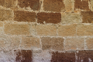 brick wall block brown and beige background closeup