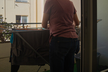 hanging clothes on the balcony