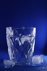 different cold ice cubes on a blue background