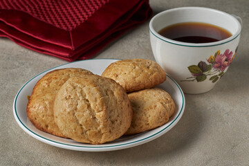 A plate with homemade cookies and a cup of coffee