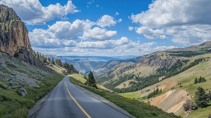The scenic Beartooth Highway leading to Yellowstone with panoramic views of the surrounding wilderness.