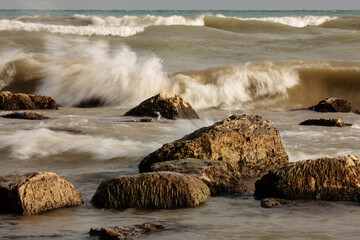 A very rough Lake Michigan crashes on-shore during a windy November day at Harrington Beach State...