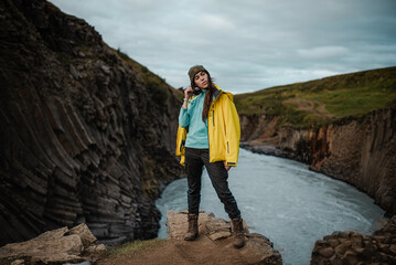 Traveler Against Rocky Gorge Background