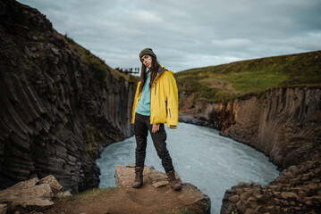 Traveler Against Rocky Gorge Background