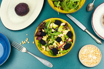 Fresh salad bowl with raw blackberries.