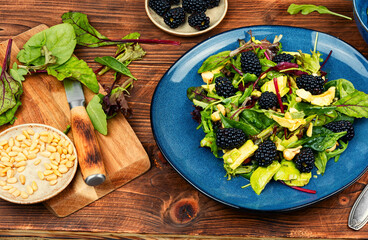 Salad with blackberries, avocado and microgreens.