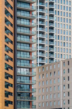 Multiple modern high-rise buildings with varied architectural designs create an intricate cityscape, illustrating urban density and striving for new heights.