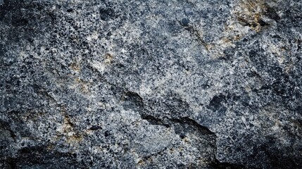 Rough granite stone background with deep textures, showcasing a mix of gray, black, and white speckles