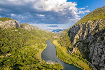 Boat in the canyon on the Cetina river near Omis, Croatia, Europe