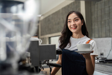 Young Barista Making Coffee in Modern Cafe, Smiling and Holding a Cup, Professional Coffee Preparation, Barista at Work