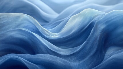 Obraz premium Gentle blue fabric waves create a serene and flowing texture resembling calm ocean currents under soft light