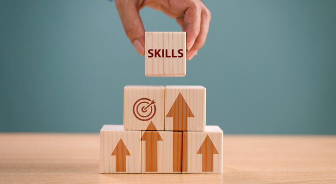 Skill individual development concept. Up new ability skill for business technology evolution. Worker learning upskill. Hand hold wood cube on digital skill icon. Competency training, education concept