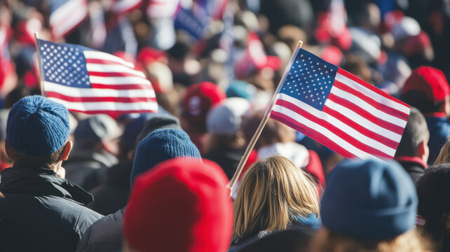 political rally in america where people are holding several flags