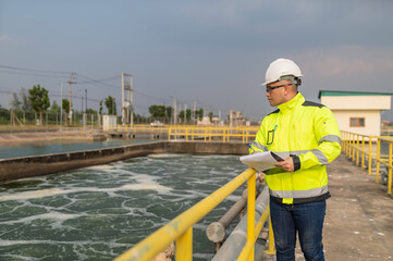 Environmental engineers work at wastewater treatment plants,Water supply engineering working at Water recycling plant for reuse