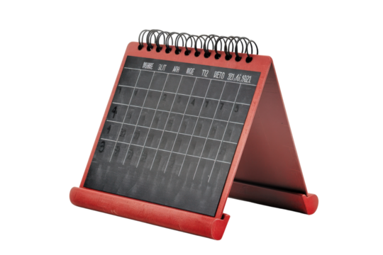 A stylish red desk calendar showcasing an organized layout, perfect for planning and scheduling tasks effectively.