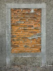 A bricked-up door on a sidewalk