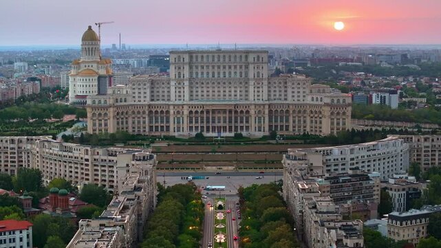 Aerial drone view of the Palace of Parliament in Bucharest, Romania at sunset