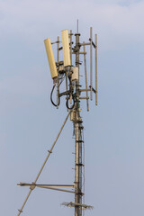 Communication tower top. Radio antenna Tower , microwave antenna tower on light sky background. wireless technology concept. communication development concept. image for objects and article.