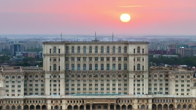 Aerial drone view of the Palace of Parliament in Bucharest, Romania at sunset