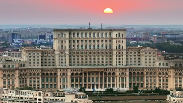 Aerial drone view of the Palace of Parliament in Bucharest, Romania at sunset