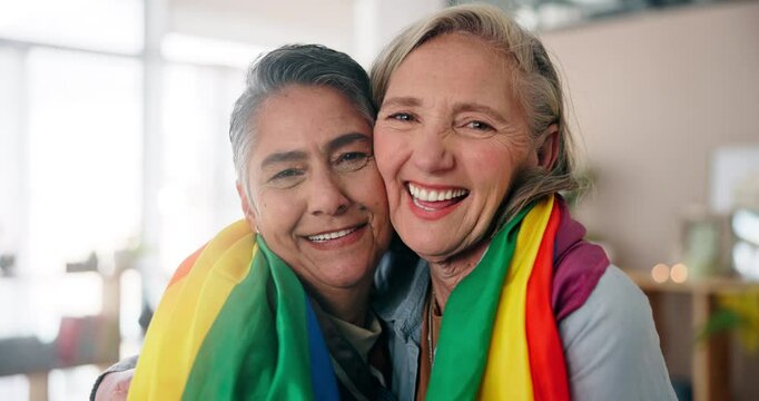 Face, happy lesbian couple and pride flag for love, support and laughing in home. Portrait, gay and mature women smile in relationship with commitment, loyalty and celebration of lgbt history month