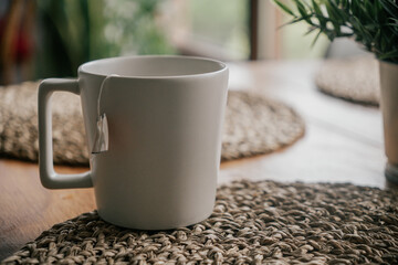 Coffee cup on wooden table in coffee shop, stock photo