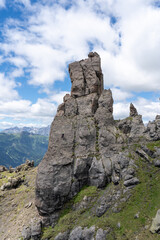Via Ferrata delle Trincee, Dolomites, Val di Fassa Valley. Man climbing the vertical rocky mountain.