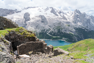 Via Ferrata delle Trincee, Dolomites, Val di Fassa Valley. Ruins, Fedaia lake and Marmolada massif...