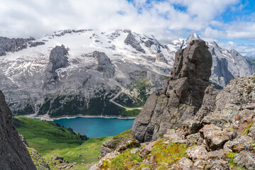 Via Ferrata delle Trincee, Dolomites, Val di Fassa Valley. Fedaia lake and Marmolada massif group with glacier background