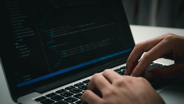 Digital technology, software development concept. Developing programmer, software developer coding computer code on laptop computer. Perfect for coding, IT solutions, applications, coding javascript