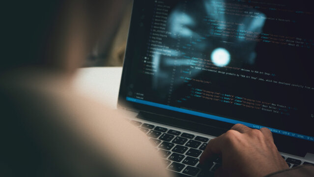 Digital technology, software development concept. Developing programmer, software developer coding computer code on laptop computer. Perfect for coding, IT solutions, applications, coding javascript