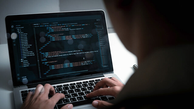Digital technology, software development concept. Developing programmer, software developer coding computer code on laptop computer. Perfect for coding, IT solutions, applications, coding javascript