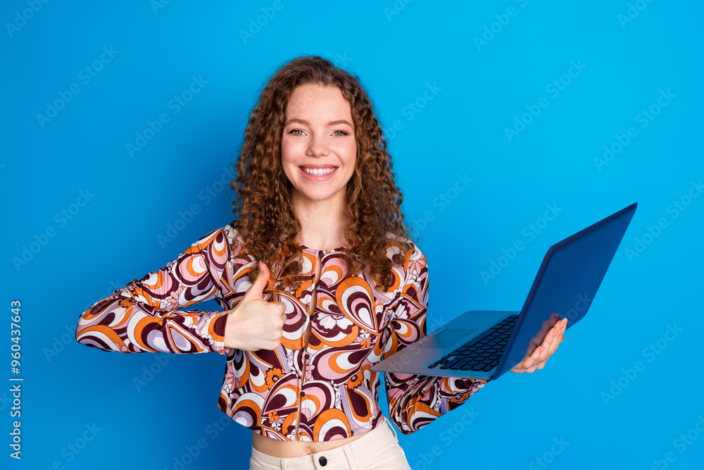 Canvas Prints Photo portrait of pretty young girl hold netbook thumb up wear trendy colorful outfit isolated on blue color background