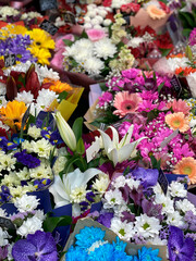 beautiful, bright bouquets of flowers in the shop, daytime. Floristry, increase in prices for flowers, painstaking work, season
