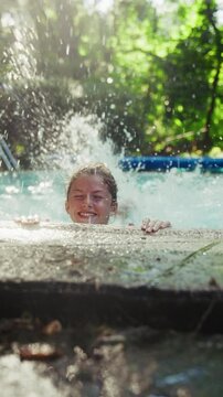 Girl Doing Flutter Kicks While Holding Onto The Pool Coping
