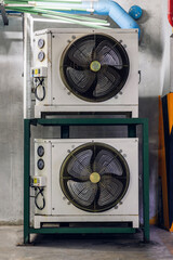Air conditioner compressor installed in old building. Outdoor split wall type air conditioner...