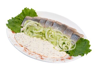 Gourmet Herring Salad with Creamy Mustard Sauce and Fresh Greens on a Plate